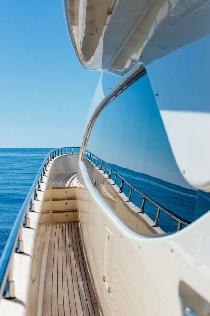 Vertical shot from the yacht of the sea and a blue sky at daytime